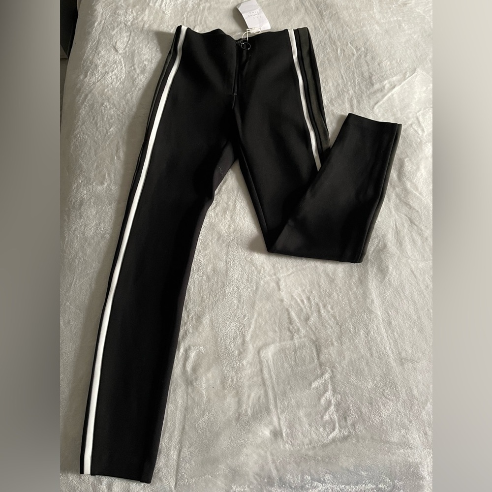 Zara black leggings- black and white stripes in the sides with a middle zipper